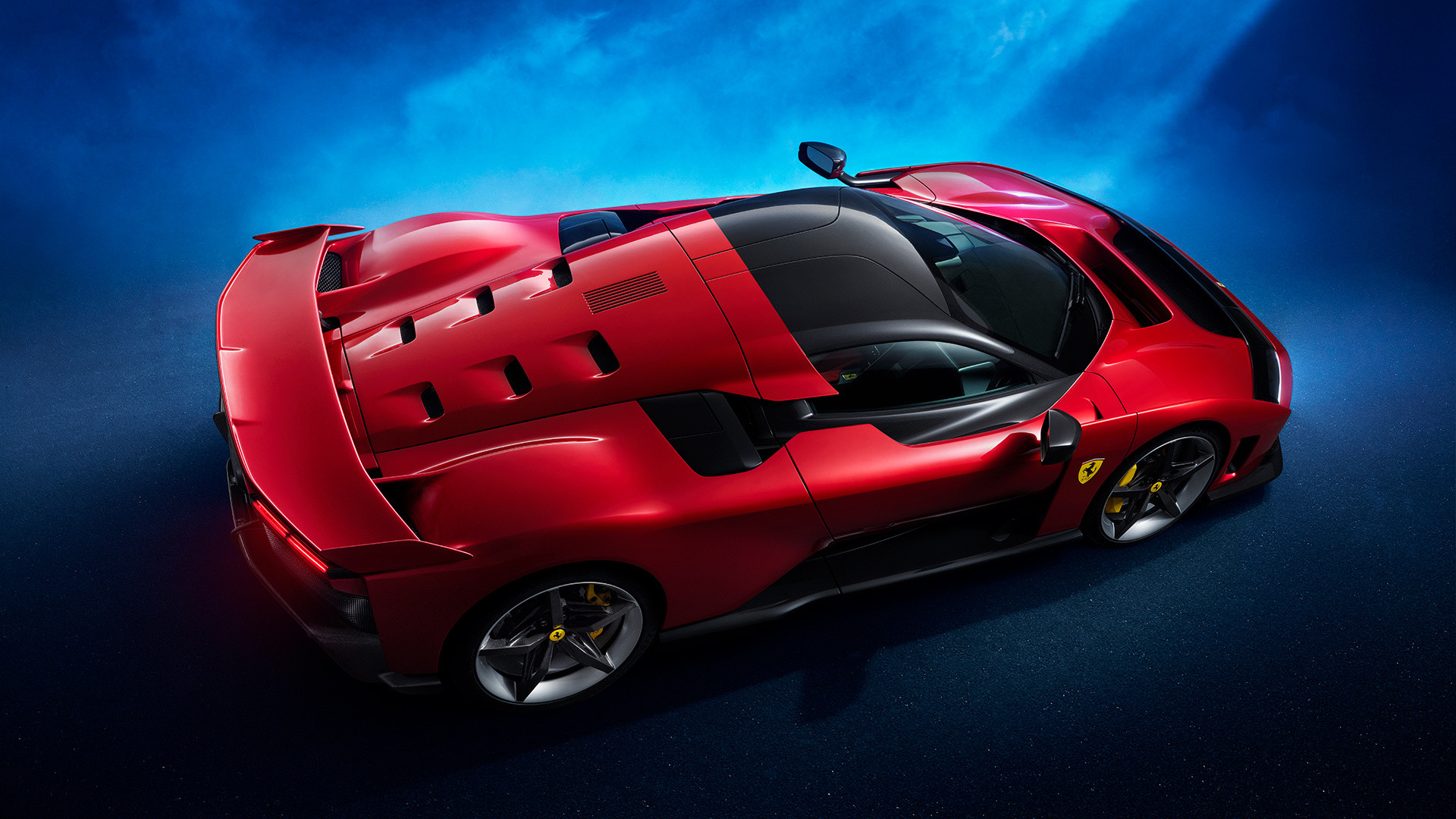 Sleek, red, mid-engined and with a big wing suggests Ferrari.