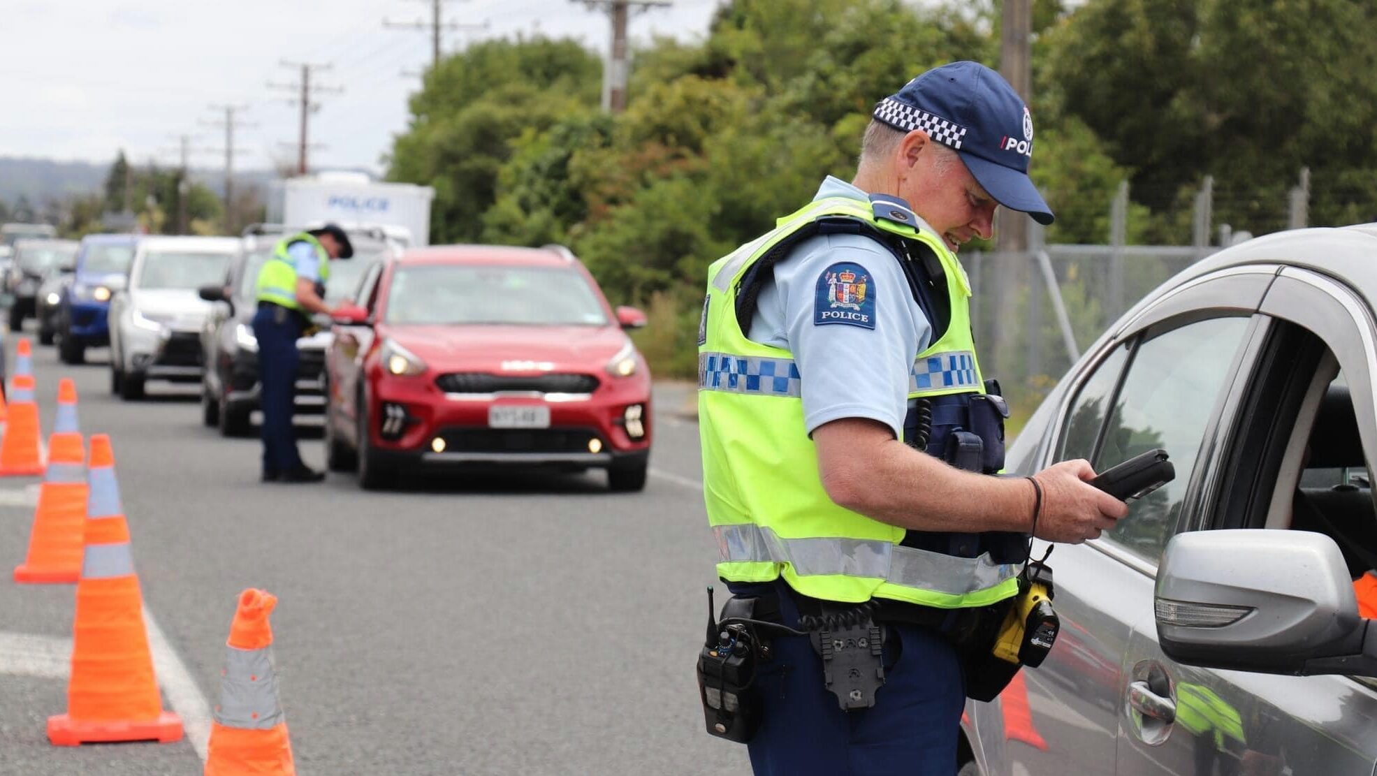 Police at a check point assessing driver impairment.