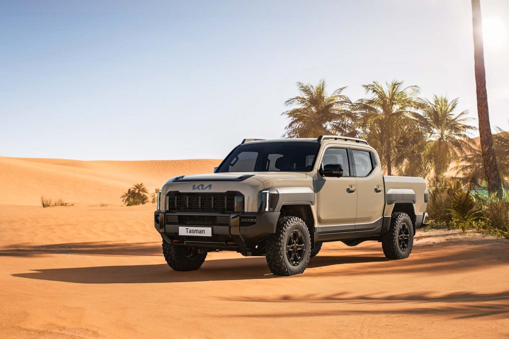 Kia Tasman parked in a desert