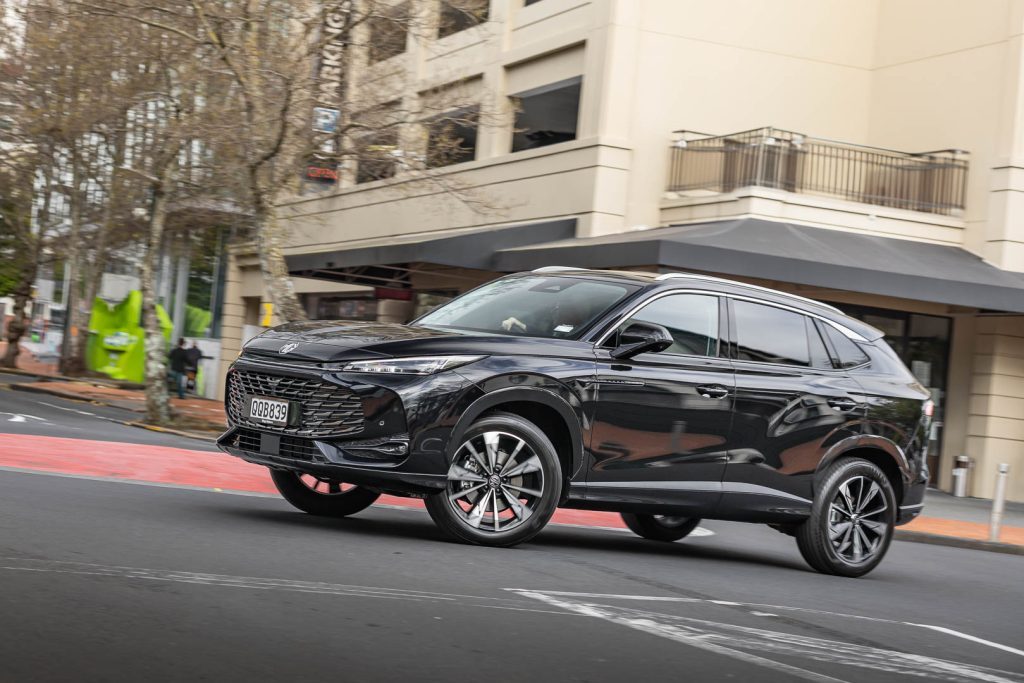 Cornering shot of black MG SUV in Auckland CBD