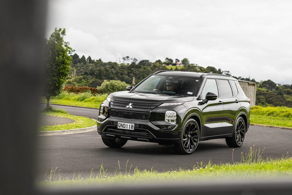 Mitsubishi Outlander in black, cornering