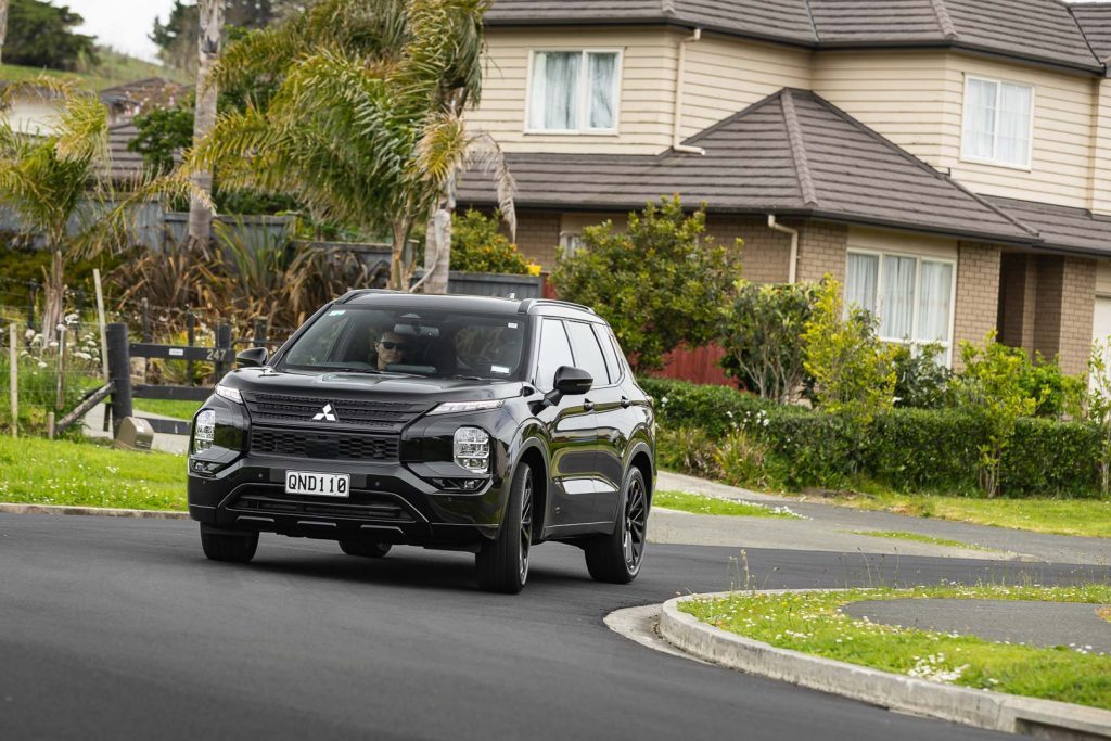 2024 Outlander taking a corner in a suburban street