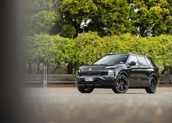 Mitsubishi Outlander in black, parked showing front quarter of car