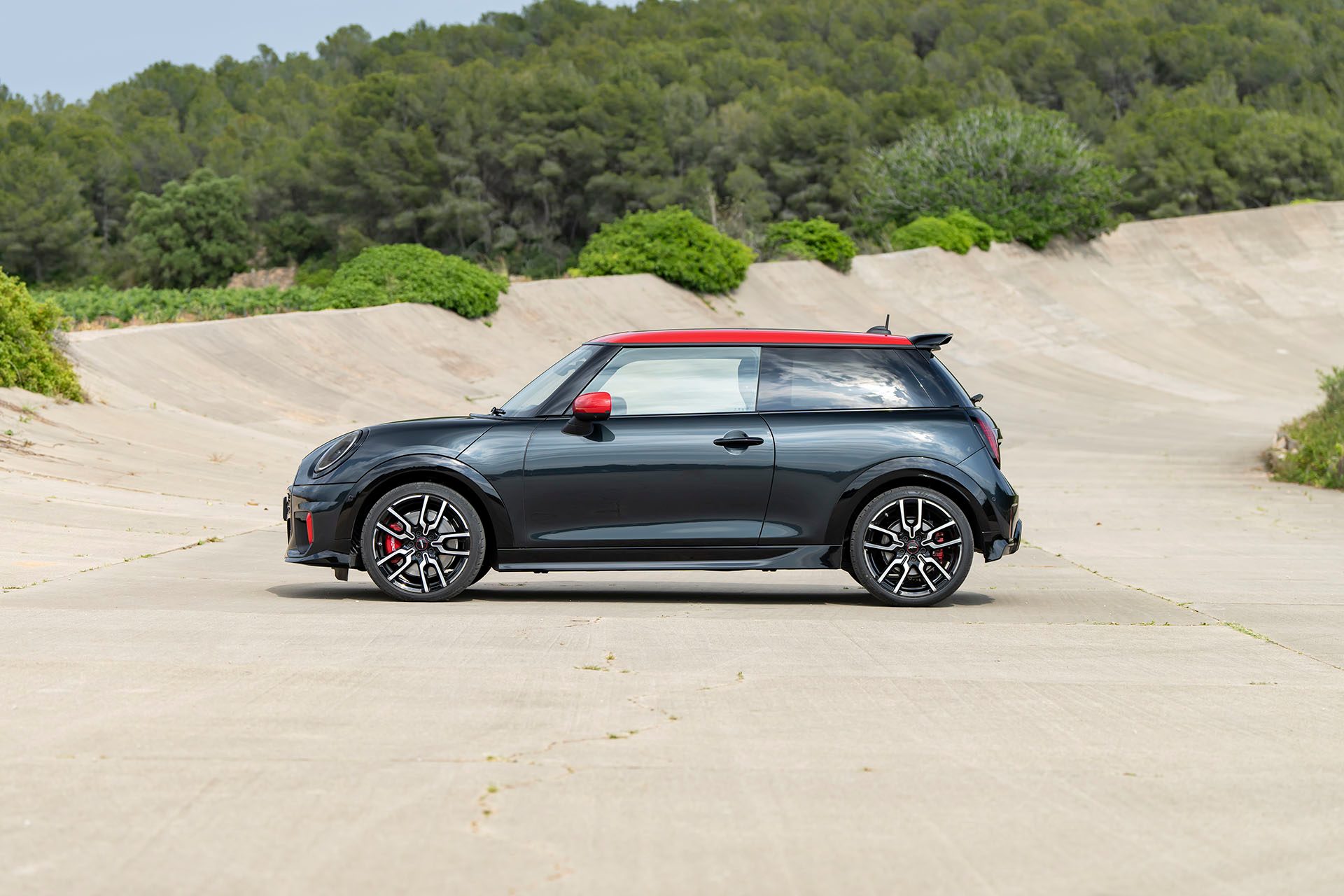 Pick the JCW Cooper by its red and black items.