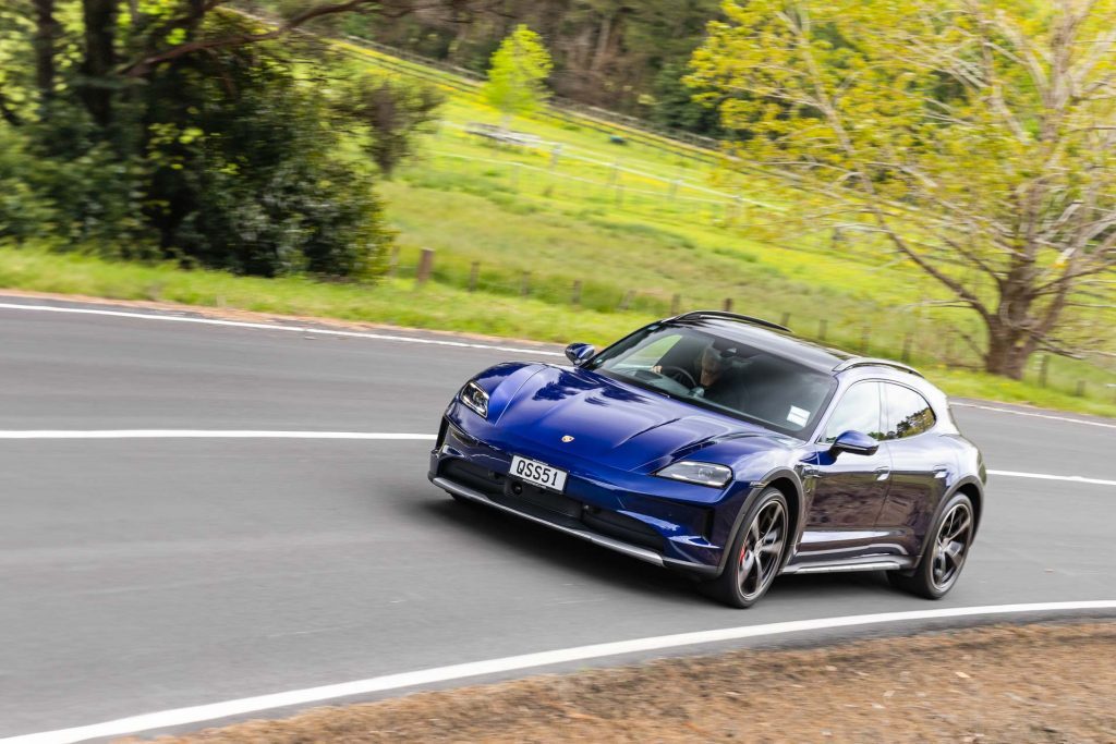 Blue Porsche Taycan Cross Turismo, cornering at pace