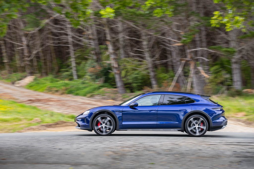 2024 Porsche Taycan 4S Cross Turismo in blue, panning side shot