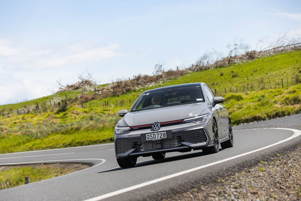 Volkswagen Golf GTI front angle taking a corner at pace