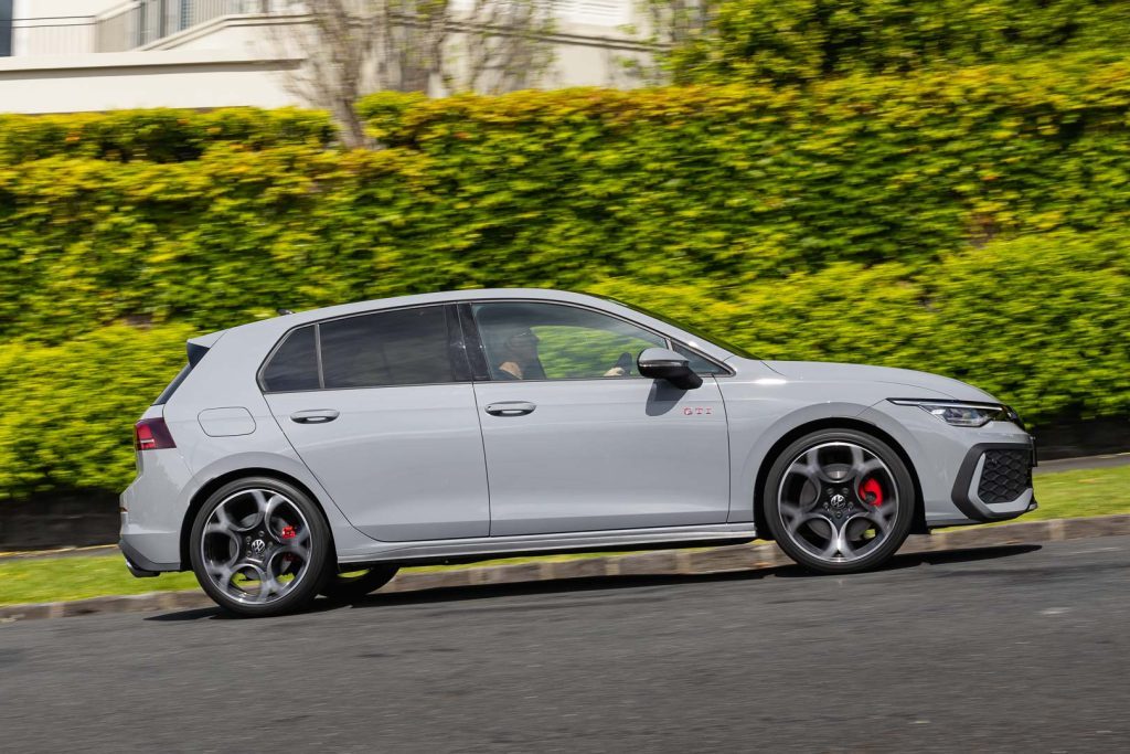 Panning side shot of the 2024 GTI VW Golf