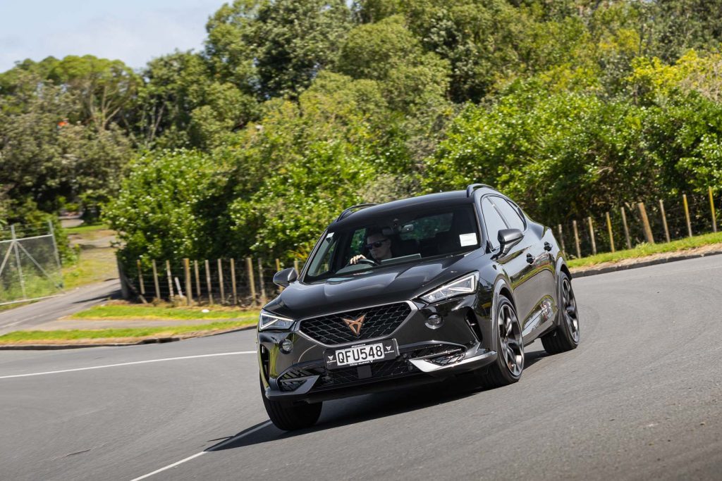 Cornering shot of the Formentor PHEV, pictured in black