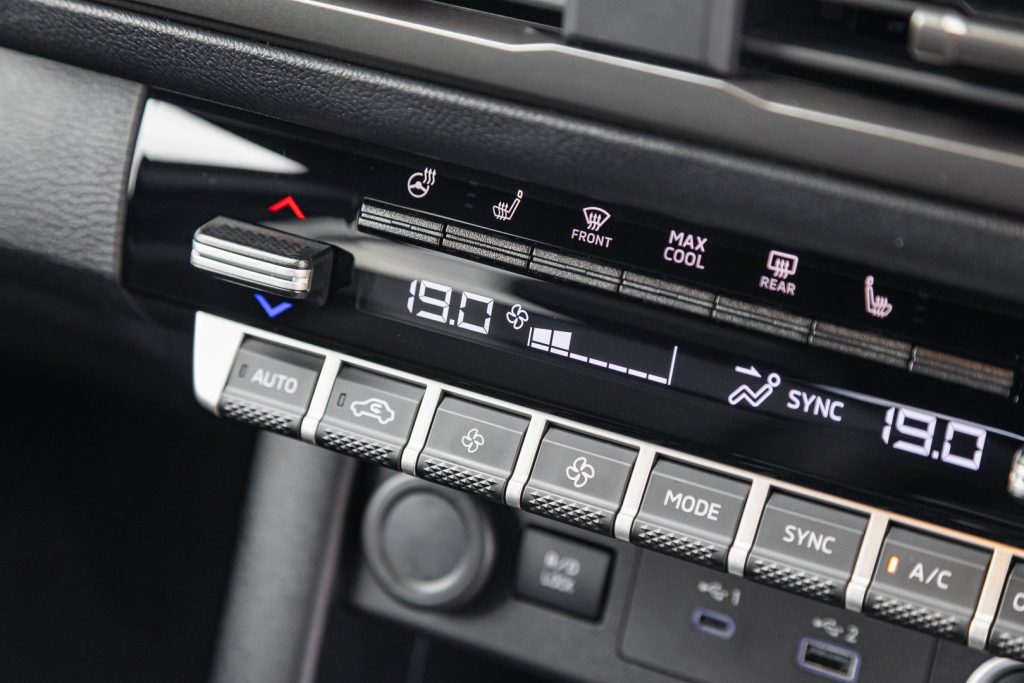 close-up of AC controls in the Triton