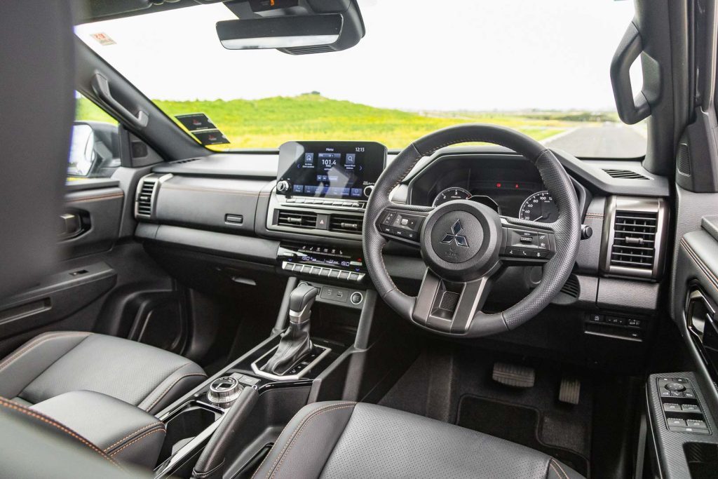 Wide interior view of the 2024 Mitsubishi Triton VRX 4X4, showing dash and infotainment