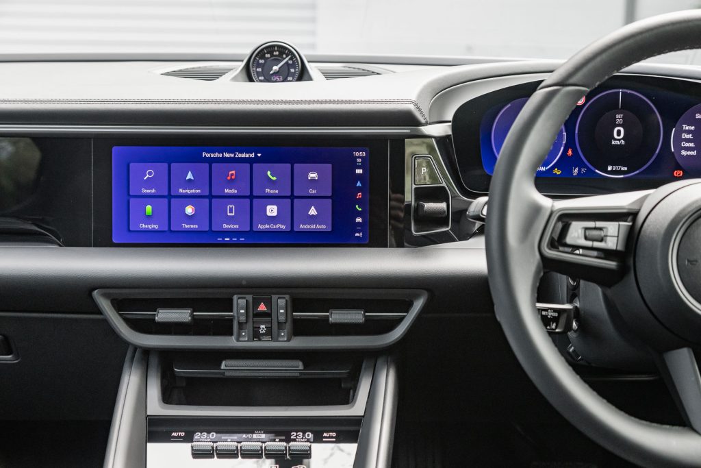 Wide shot showing infotainment screen of the 2024 Macan