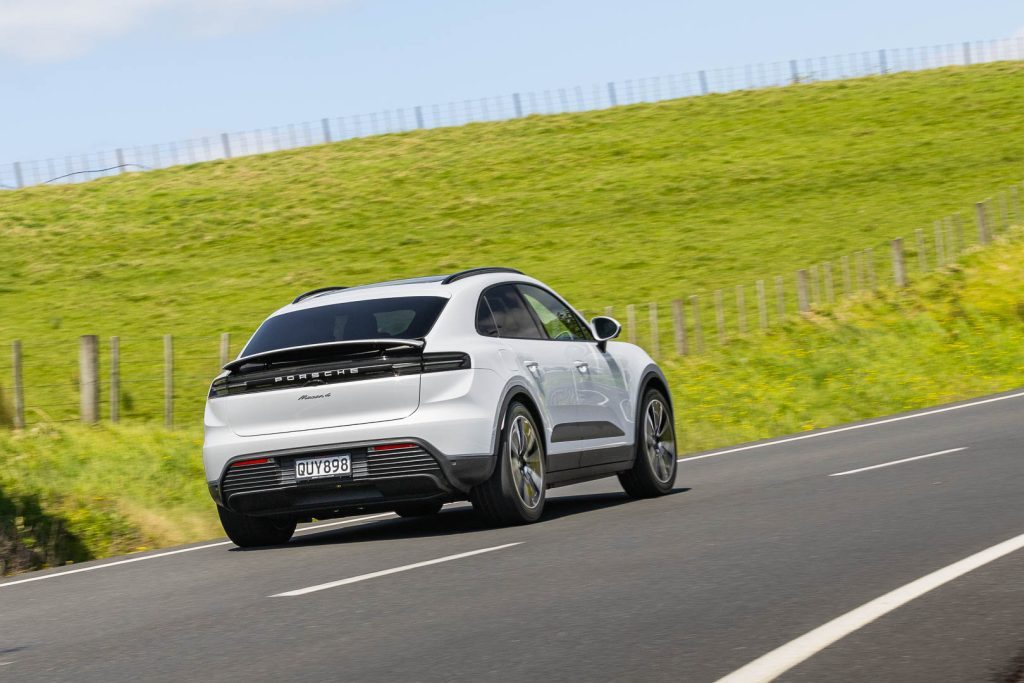 Porsche Macan 4 rear cornering shot, with wing raised