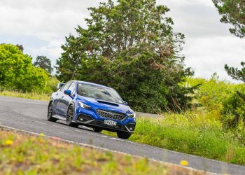 Cornering in a blue Subaru WRX Todoroki edition