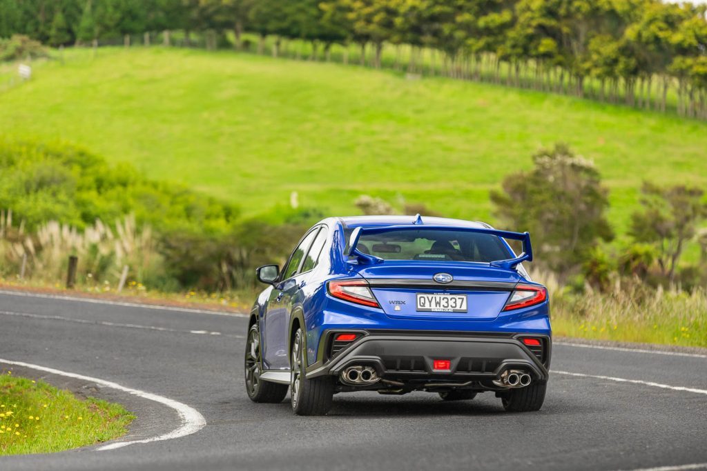 2024 Subaru WRX Todoroki in blue, cornering shown from the rear