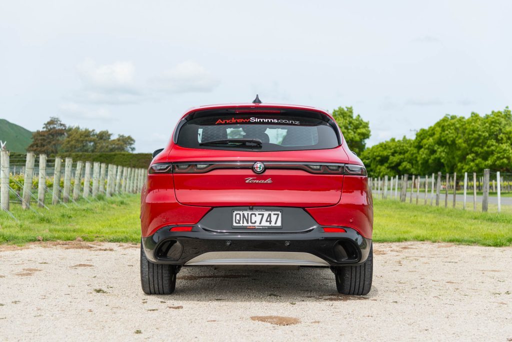 Rear view of the Alfa Romeo Tonale Ti, parked near vineyards