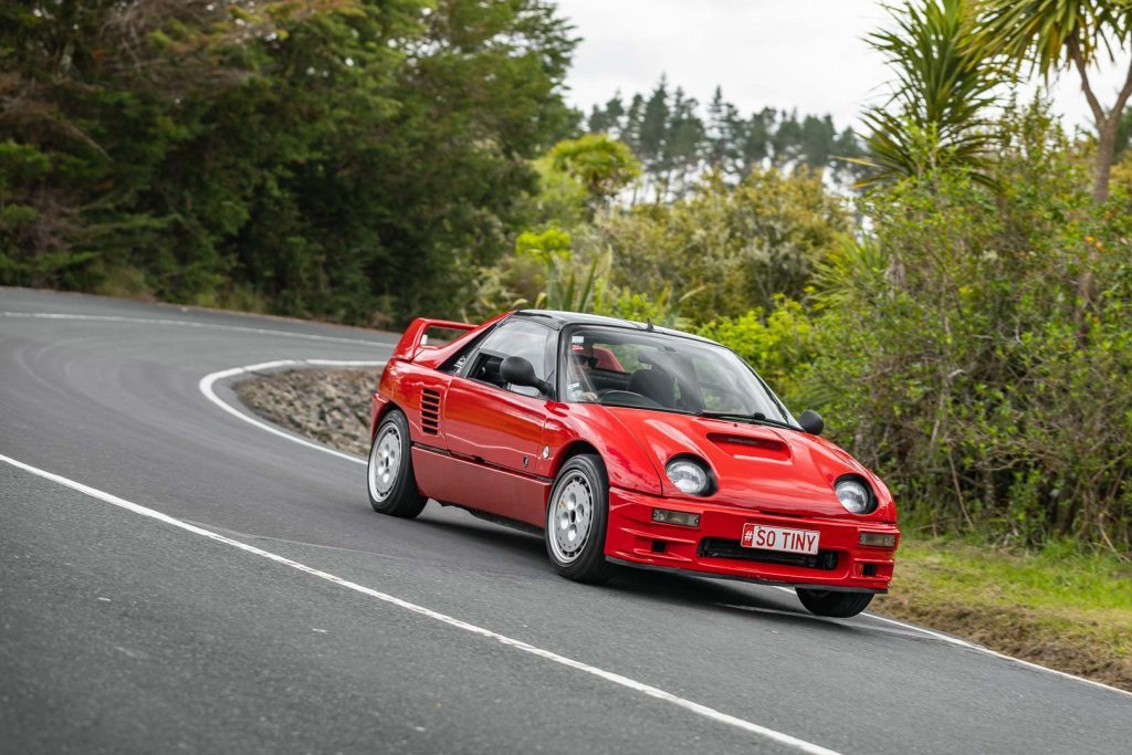 1993 Mazda Autozam AZ-1 cornering at pace, possibly with one front wheel lifting