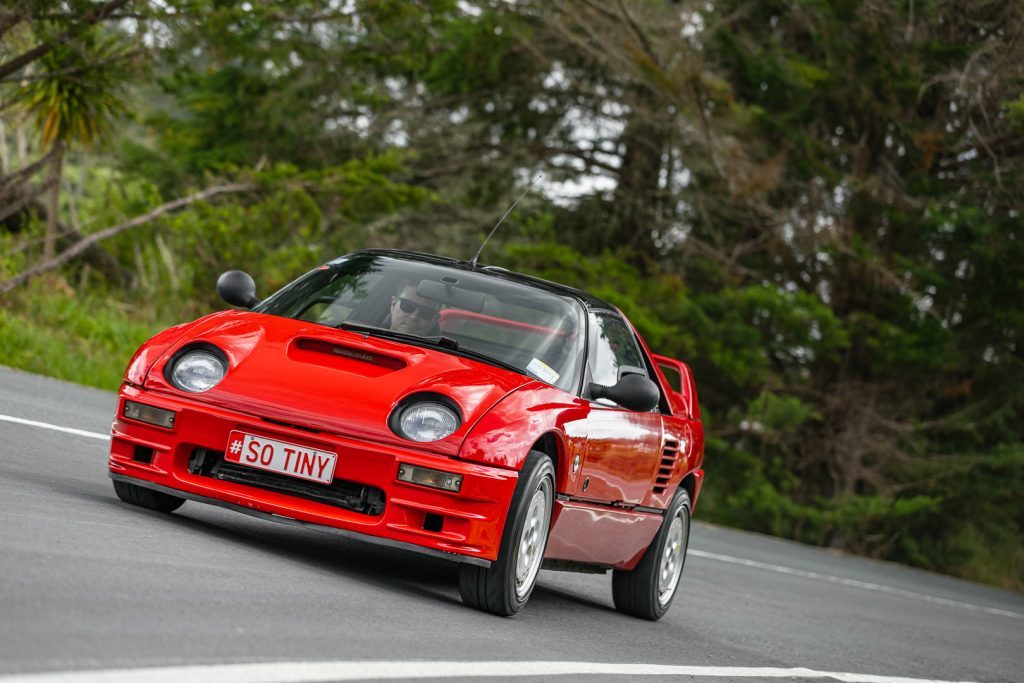 Front cornering shot of the Mazda Autozam AZ-1 Mazdaspeed edition, at pace