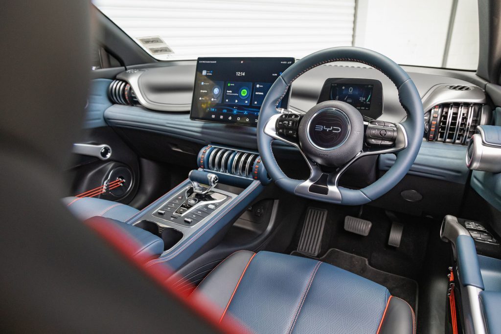 Front interior view of the 2024 BYD Atto 3 Extended, with blue interior and red accents