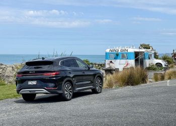 BYD sealion 6 shown from the rear end, parked next to Nins Bin caravan