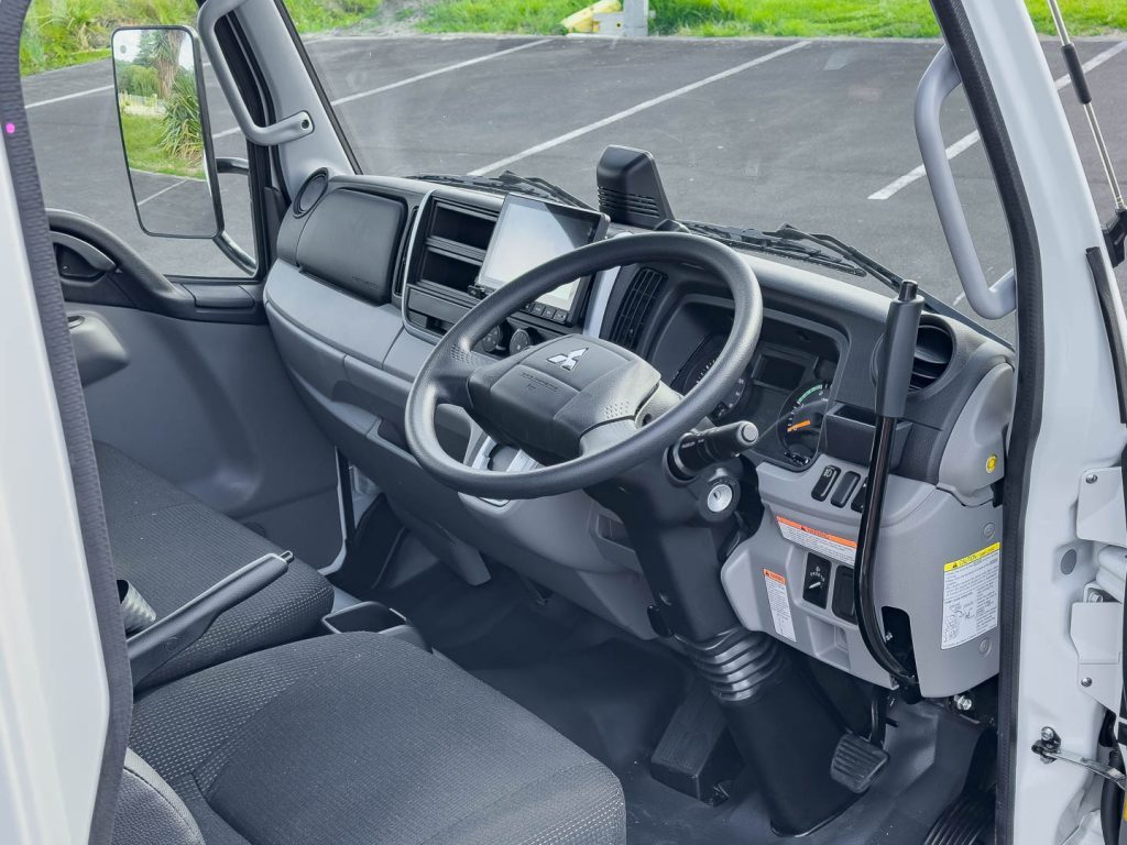 Interior shot of the Fuso Canter 616T City Tipper, with lever for tipping the tray