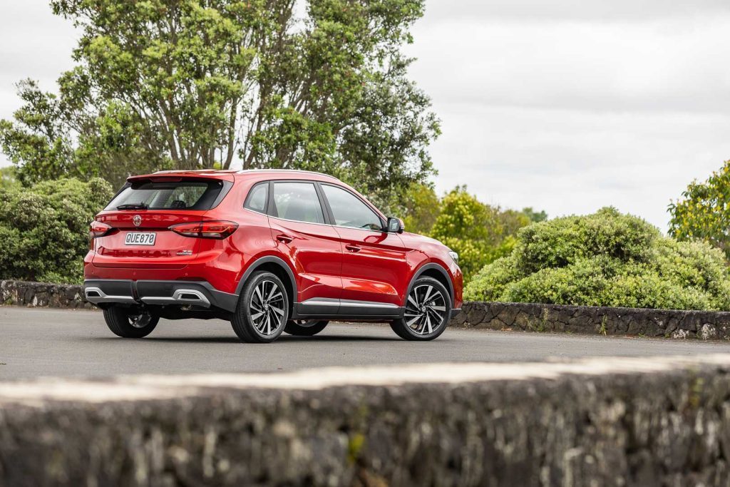 2024 MG ZS Hybrid Essence in red, parked with the rear quarter showing