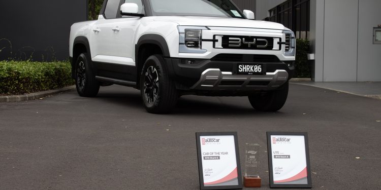 BYD Shark 6 NZ Autocar COTY parked on tarmac in front if its COTY awards