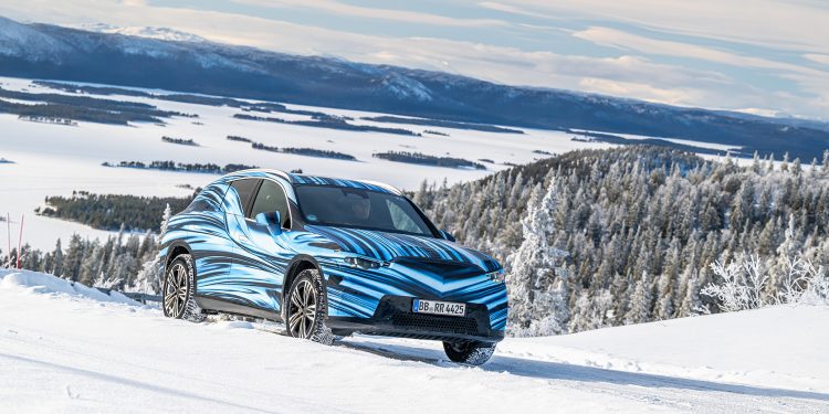 Mercedes-Benz GLC with EQ Technology in the snow with trees in the back ground